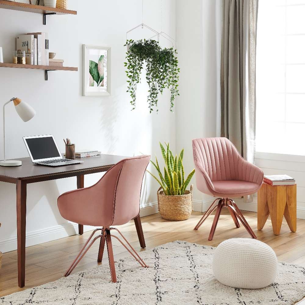 A stylish accent chair positioned at a wooden desk in a bright home office.