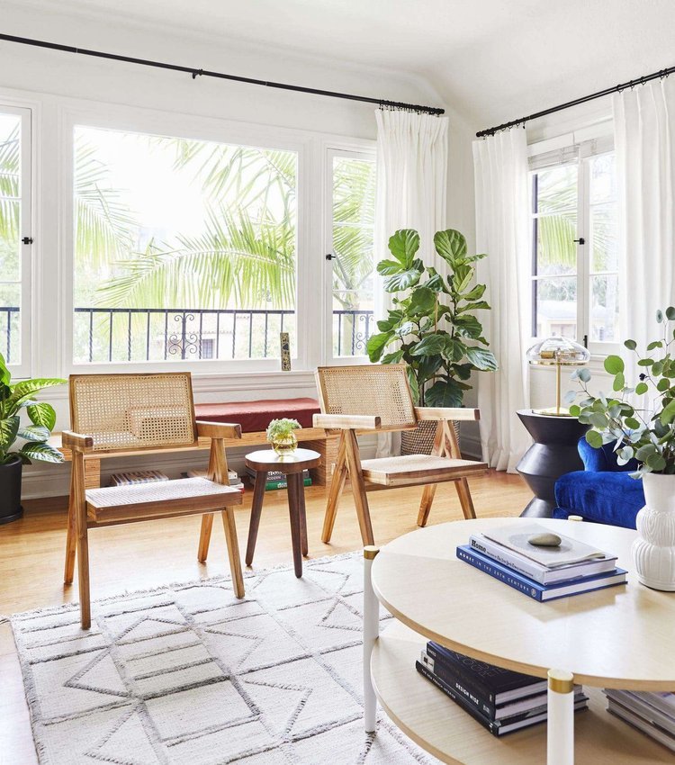 Testing a dining chair for comfort as an accent piece in a reading nook.