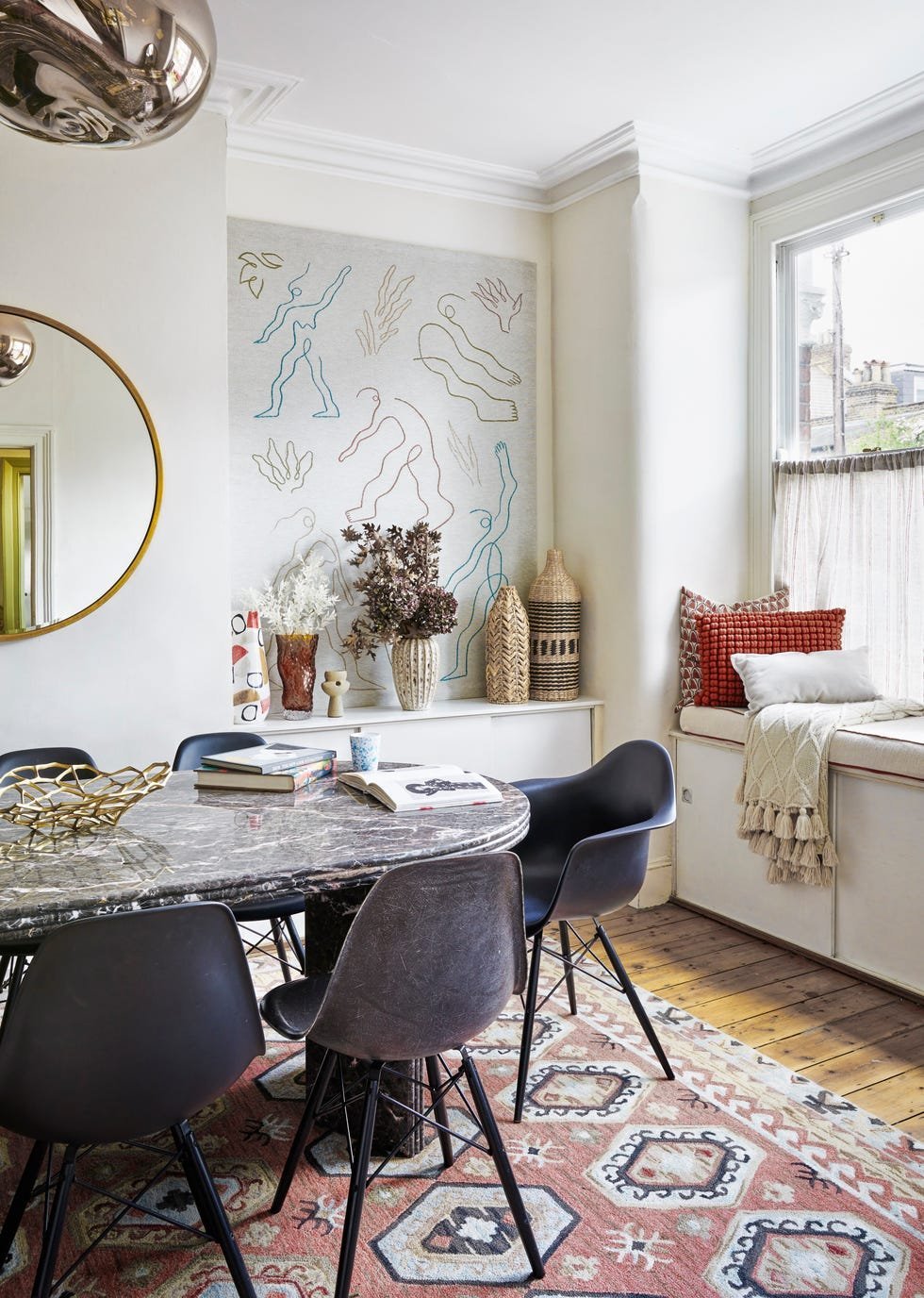A dining chair used as functional seating in a small living room space.