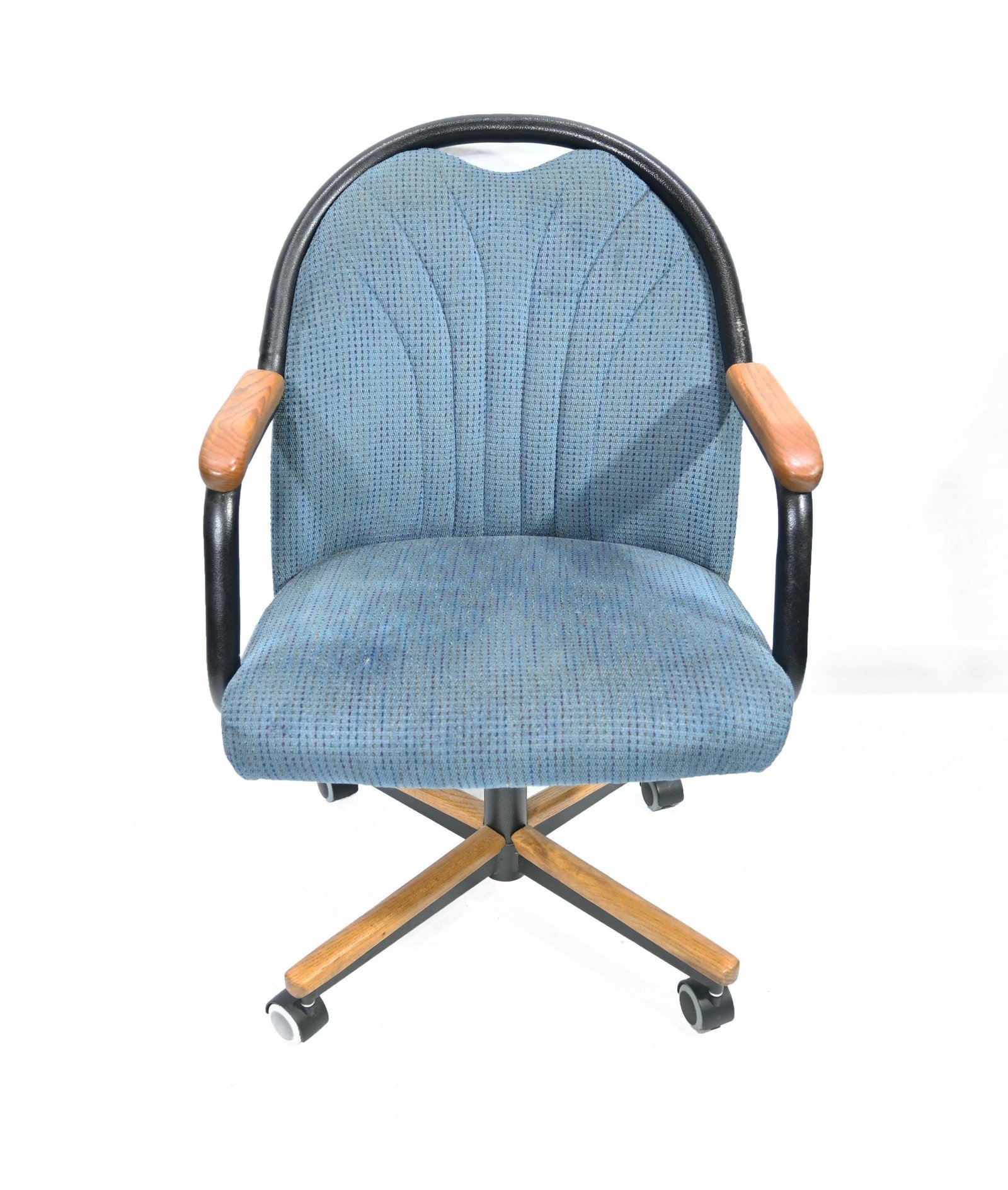 Locking rubber cups holding office chair wheels firmly on a hardwood floor.