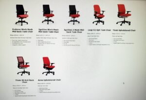 An ergonomic office chair provides essential lumbar support in a bright, modern home office.
