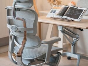 An ergonomic office chair sits in a bright, modern home office space.