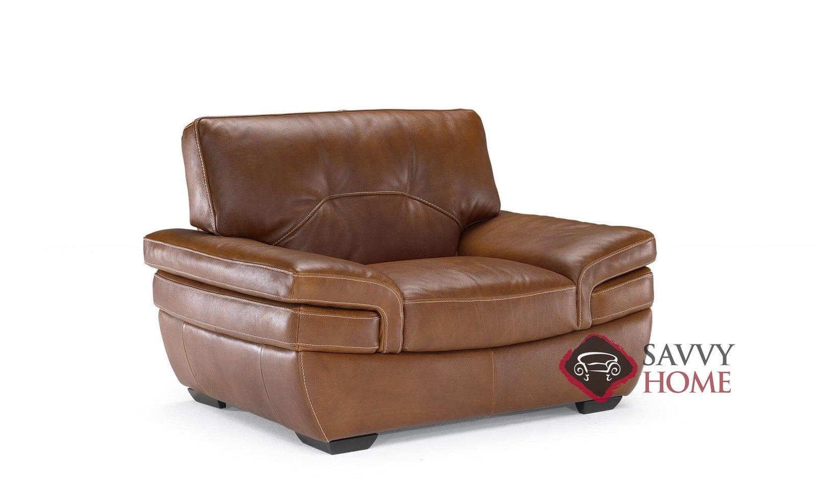 A person uses a measuring tape to measure the dimensions of a modern armchair.