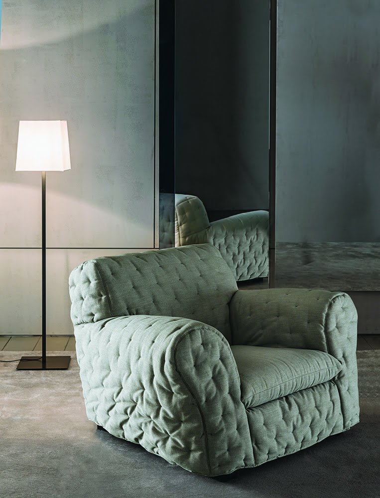 An armchair and sofa are positioned together to show correct furniture scaling and balance.