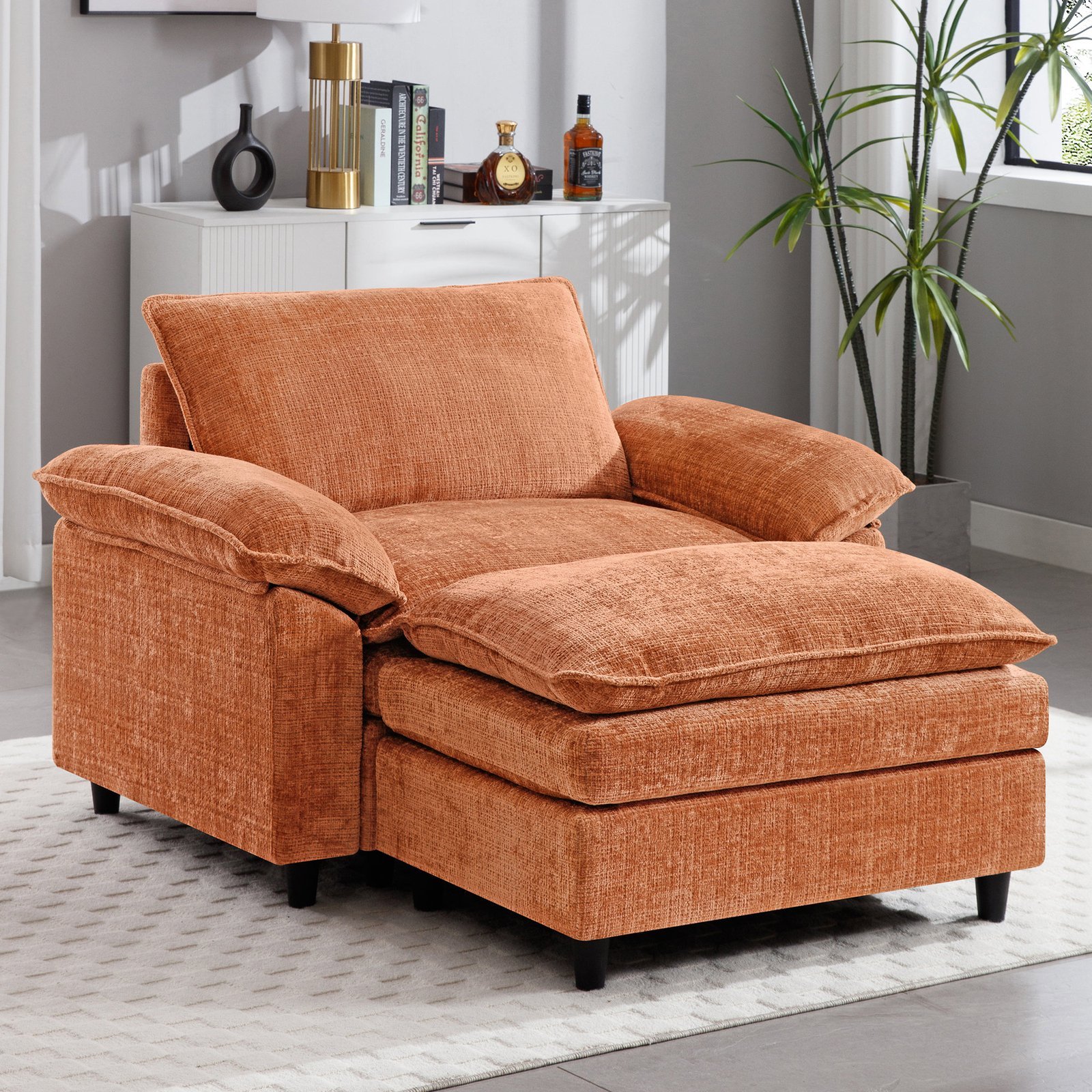 A cozy reading nook featuring a comfortable armchair arranged in a clean, modern room.