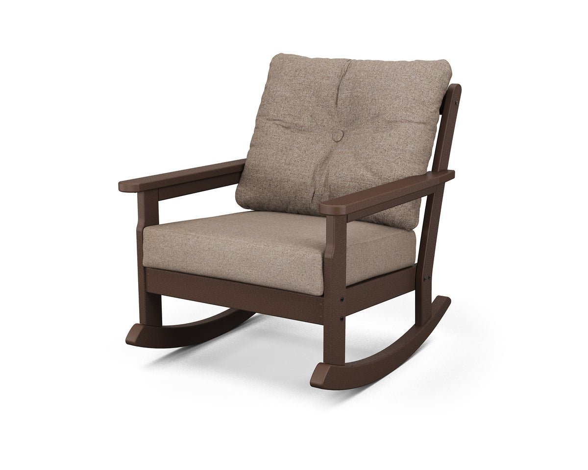 Checking the gap between the chair seat and knees for optimal seat depth.