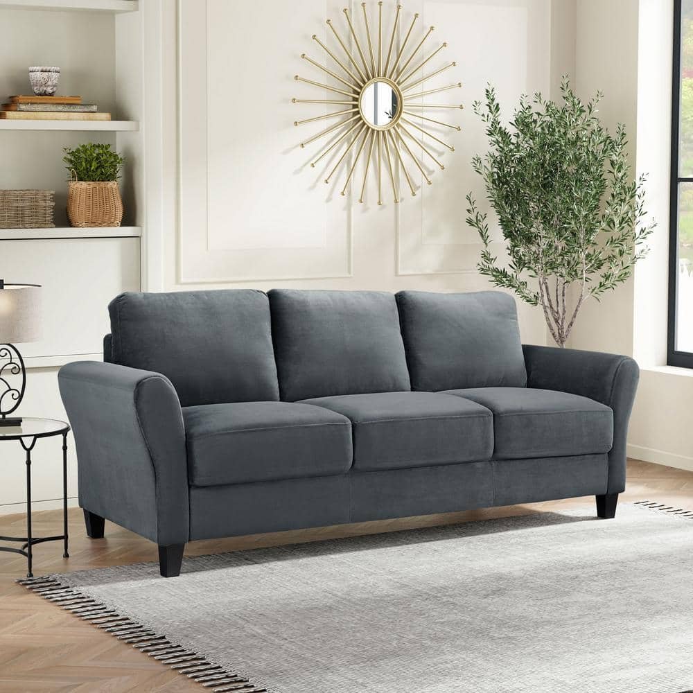 Measuring floor space to ensure a three-seater sofa fits comfortably in the room.