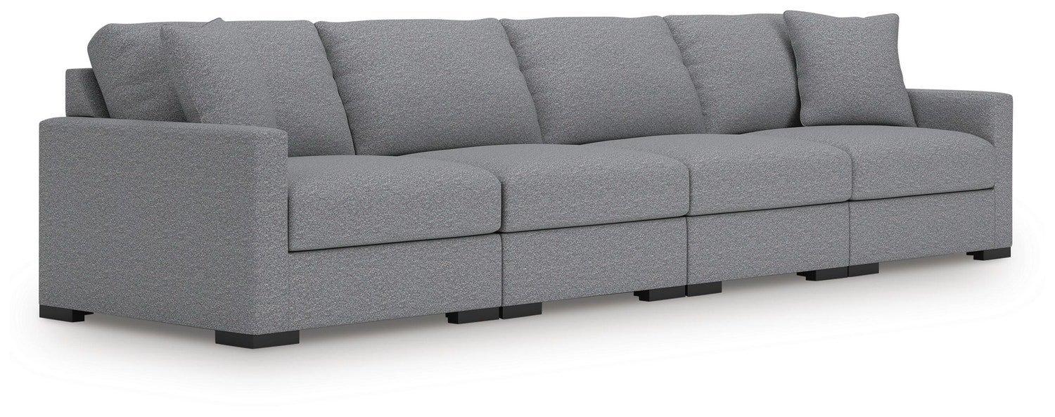 A sofa crowded in a small room showing insufficient clearance for doors and windows.