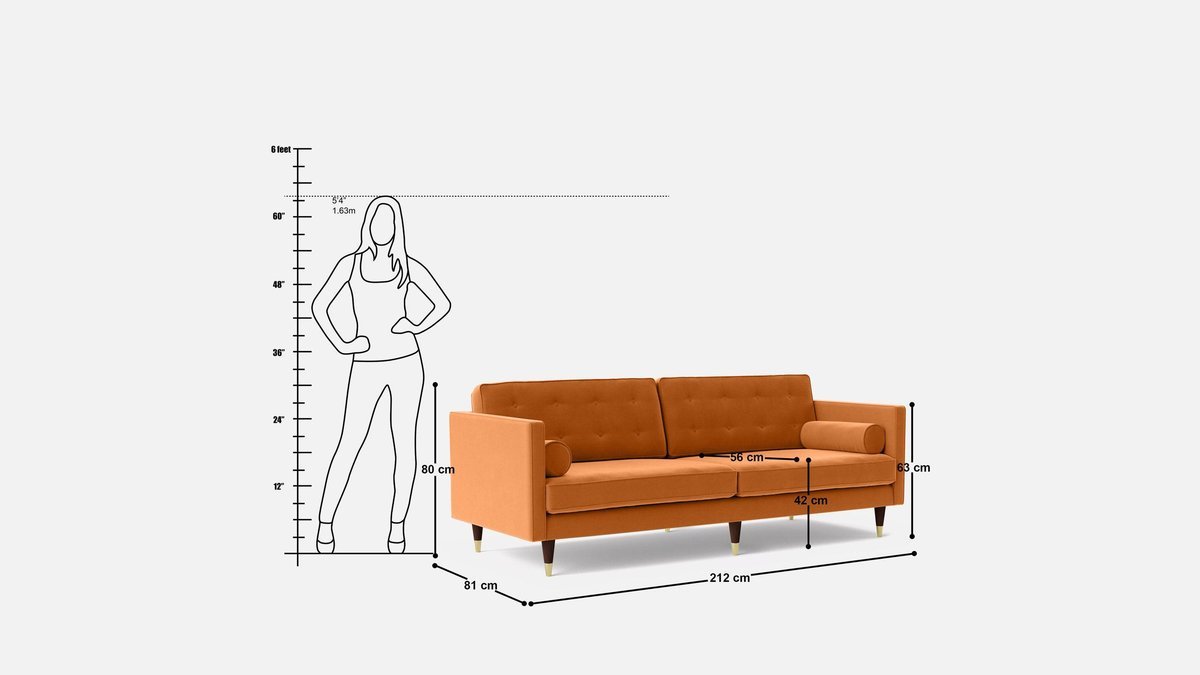 A modern three-seater sofa sits in a bright, sunlit living room space.