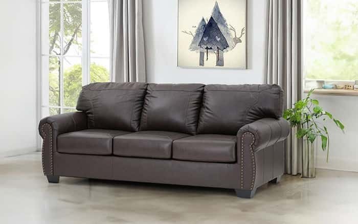 A reclining sofa showing the necessary clearance space from the living room wall.