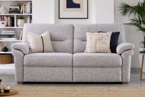 A modern 3 seater sofa sits elegantly in a bright, contemporary living room.