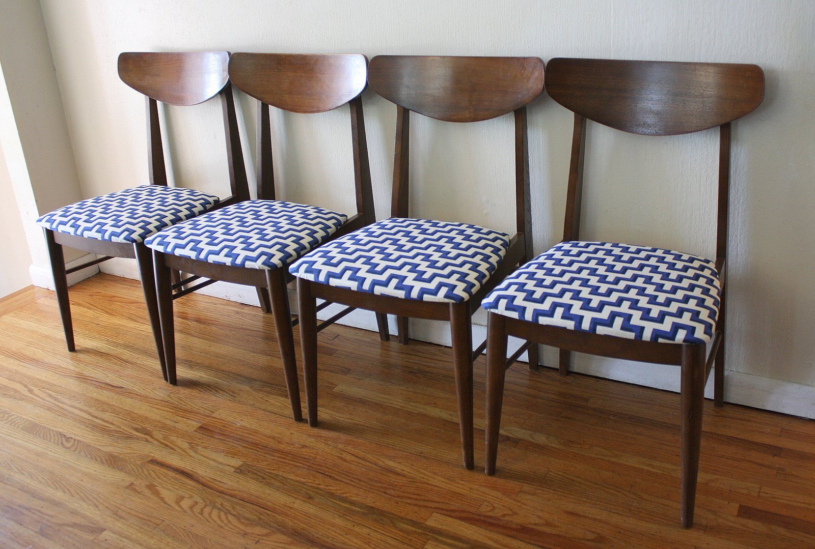 Measuring the clearance of a dining chair to ensure proper table height.