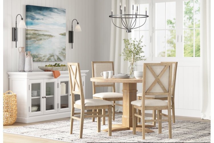 A modern dining room set with upholstered chairs showing how much dining room chairs cost.