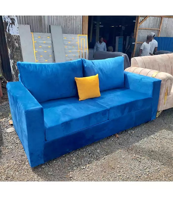 Measuring the length of a 3 seater sofa before making a purchase.