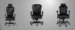 Three different computer chairs displayed in a bright modern office space.