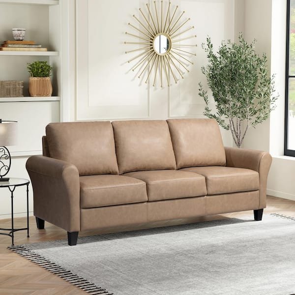 A cozy living room corner featuring a three-seater sofa and side table.