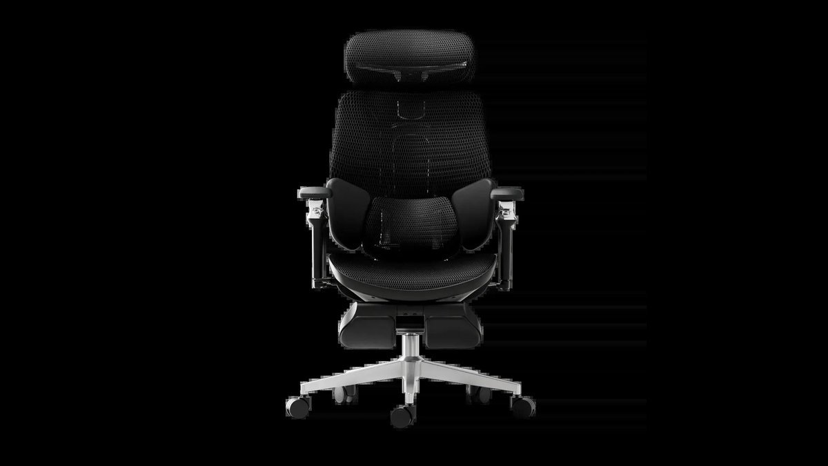 A modern ergonomic chair sits in a bright office to represent home furniture costs.