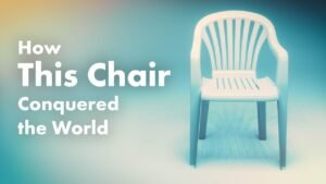 A modern designer chair stands elegantly in a bright, minimalist living room space.