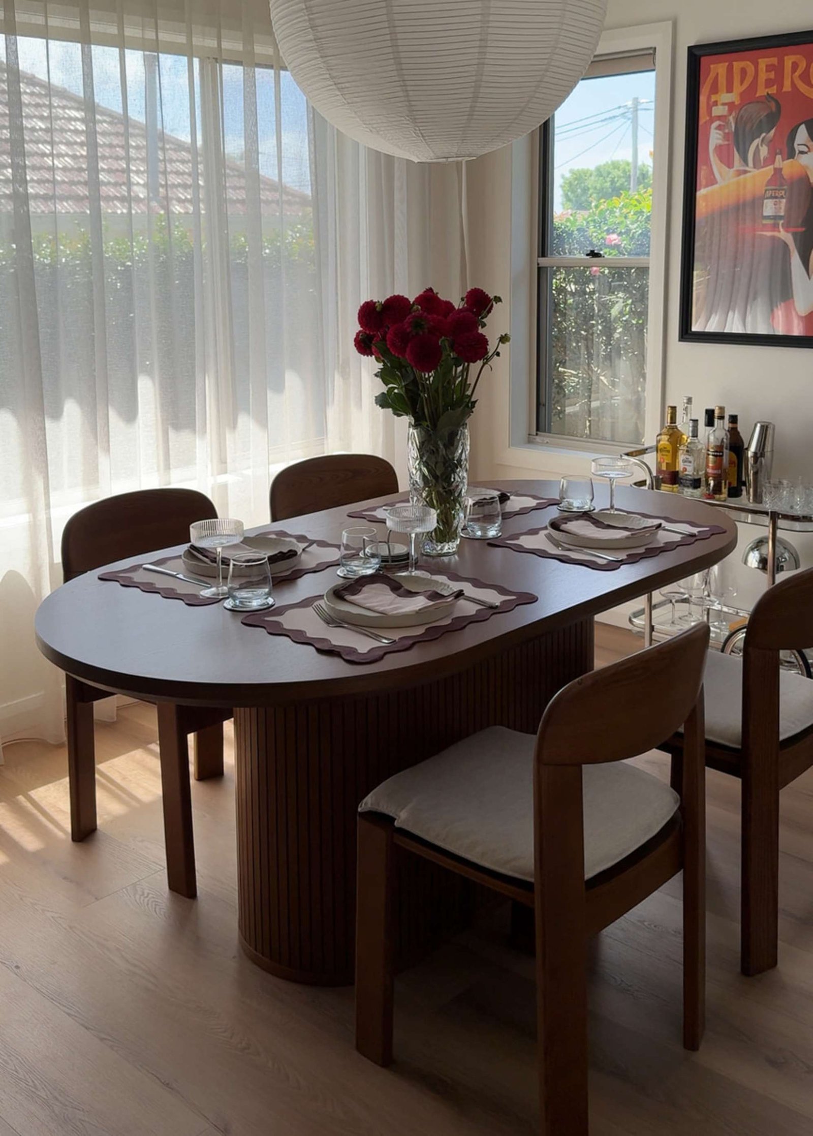 A stylishly decorated dining room chair positioned in a serene home setting.