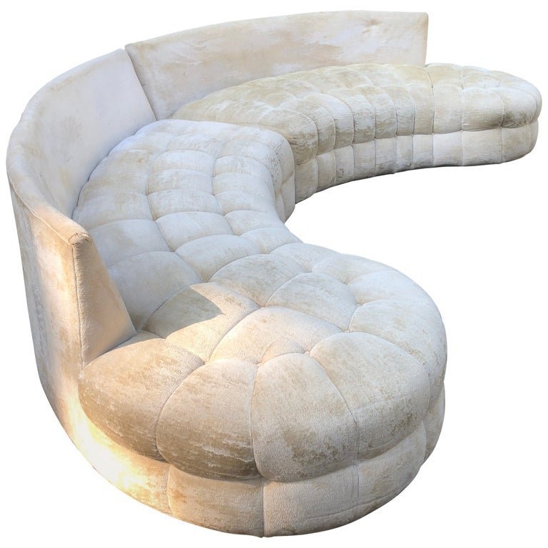 Using a mobile app to list a sofa for sale on a marketplace.