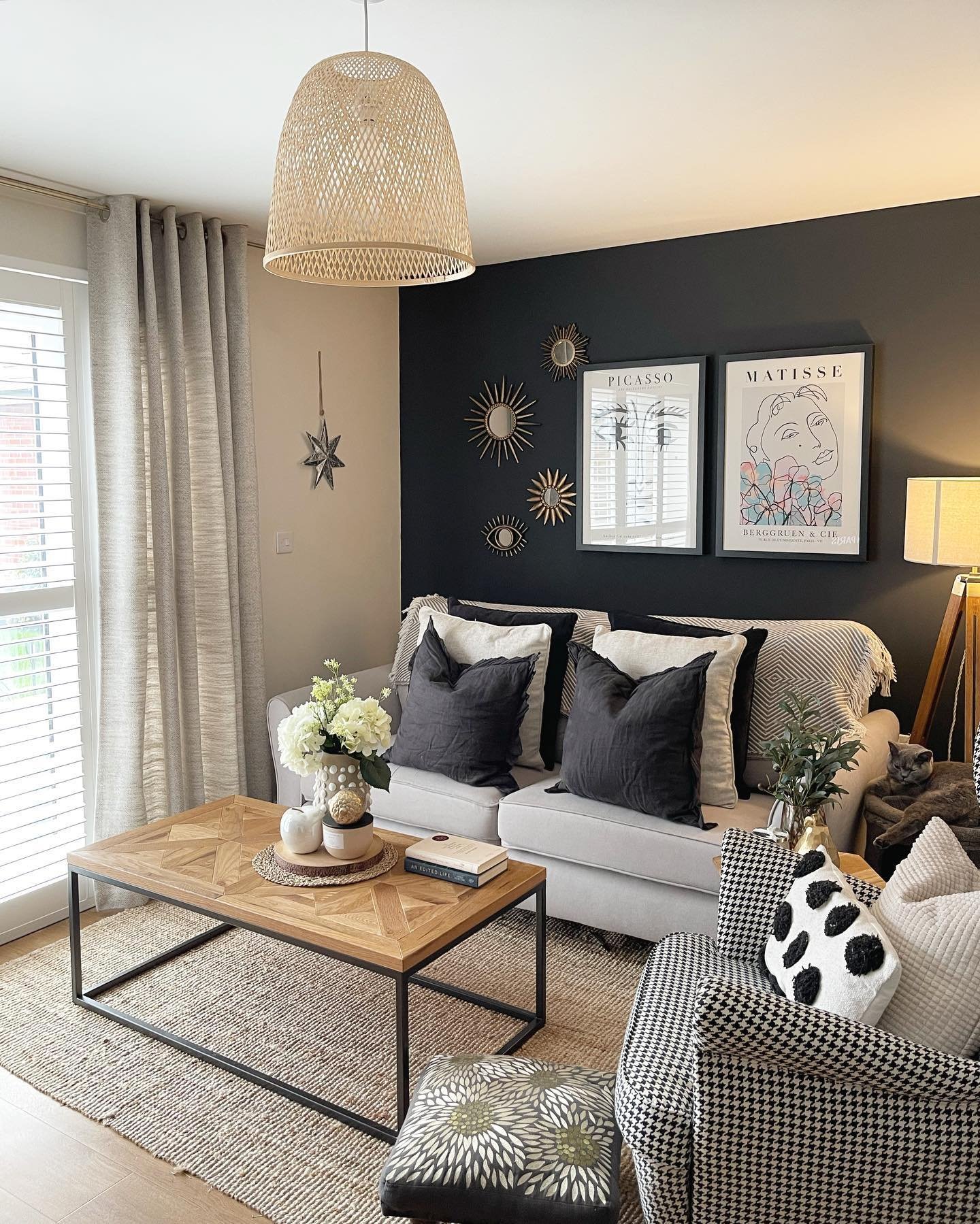A well-arranged living room layout with furniture on a rug to ensure flow.