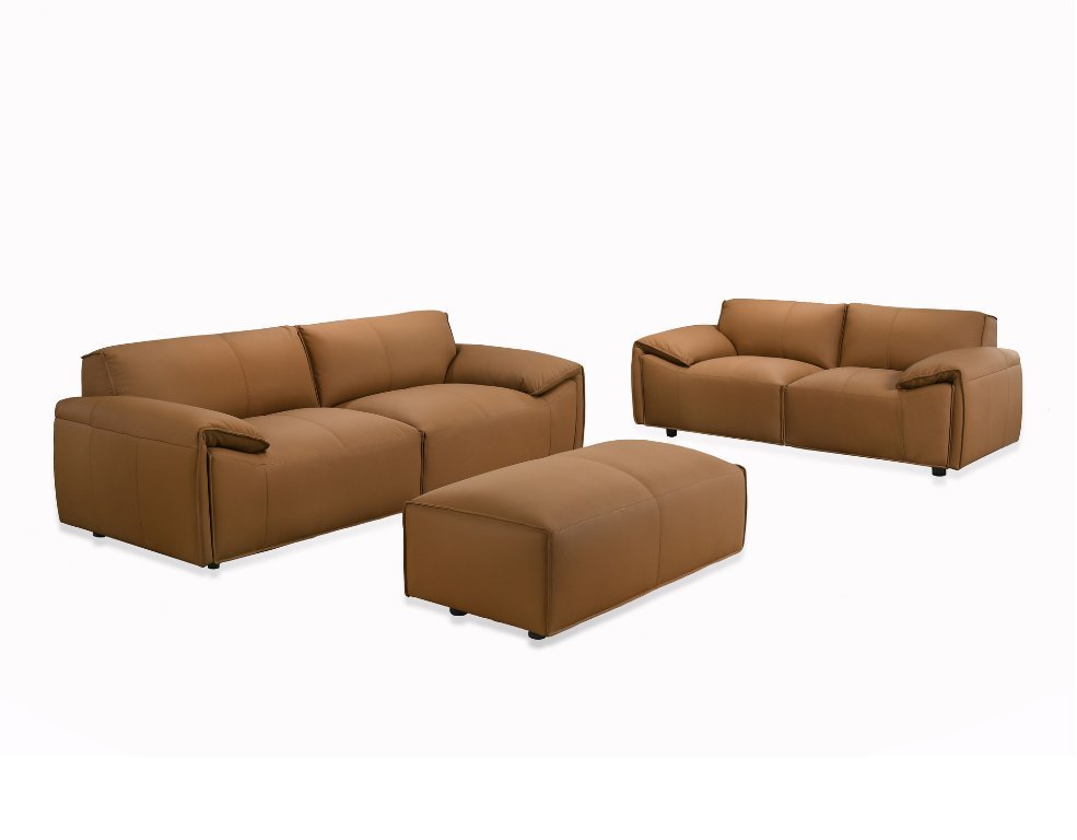 A styled living room corner demonstrating how to pair sofa and chairs effectively.