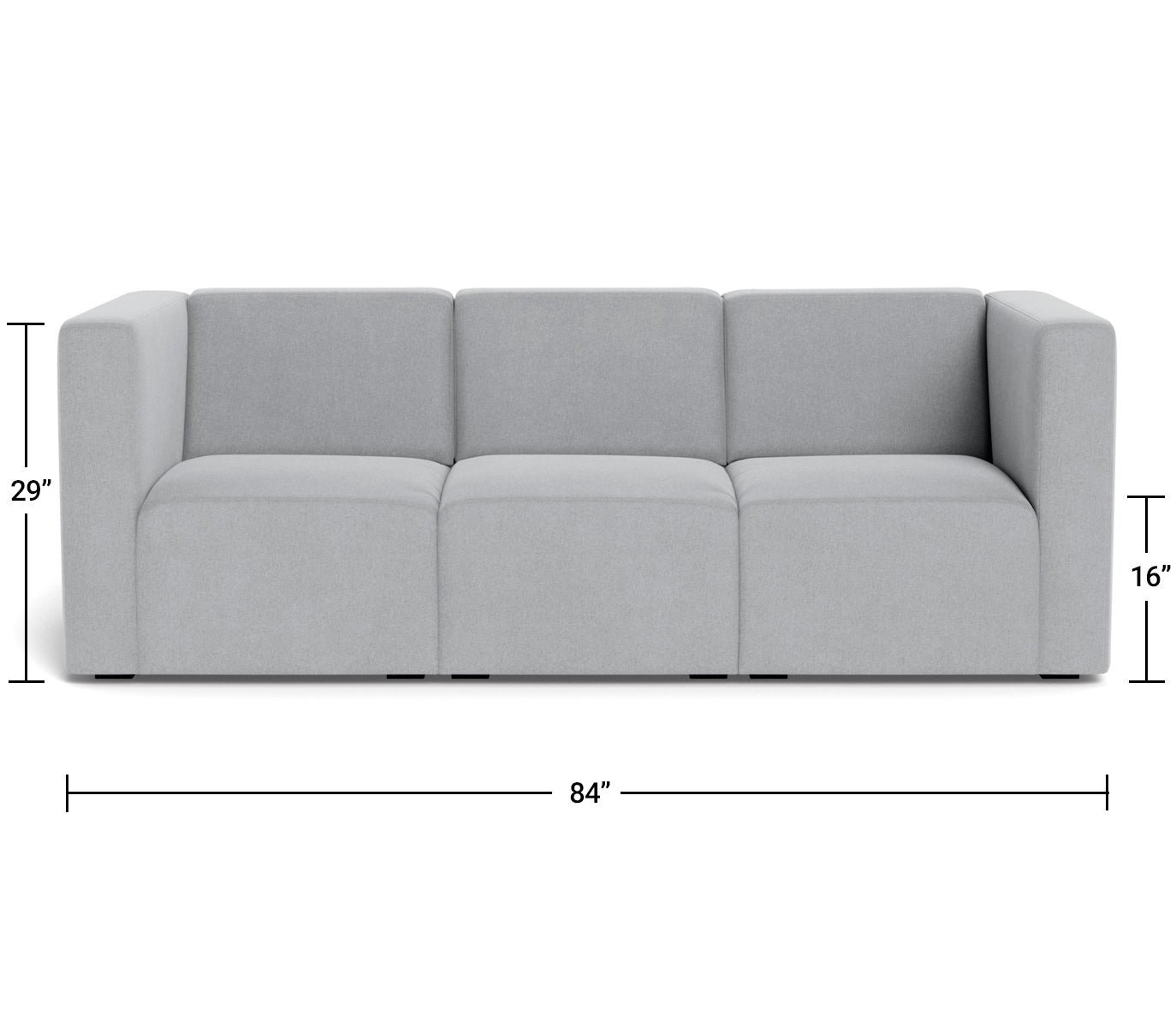 A comfortable three-person sofa in a well-lit living room setting.