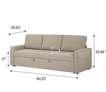 A scale model of a sofa sits on a desk next to design plans.