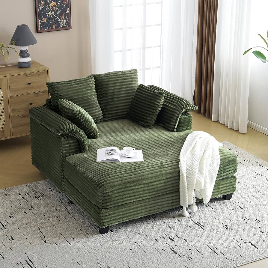 Using a tape measure to determine the width of a modern lounge chair.