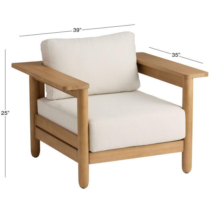 A person measures an armchair to determine fit for a narrow hallway or small apartment.