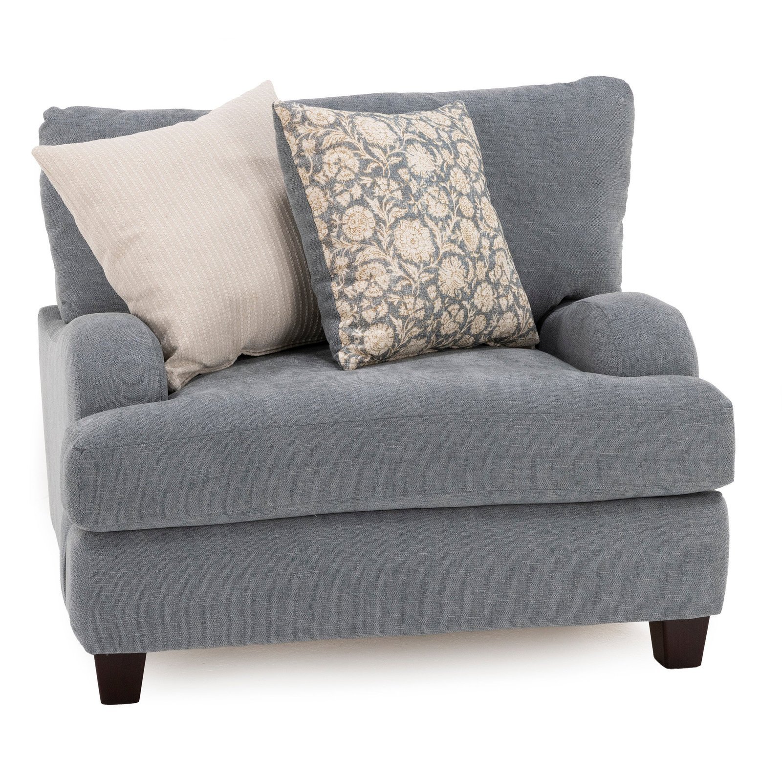 A comfortable armchair in a reading nook highlights the importance of choosing the right furniture dimensions.