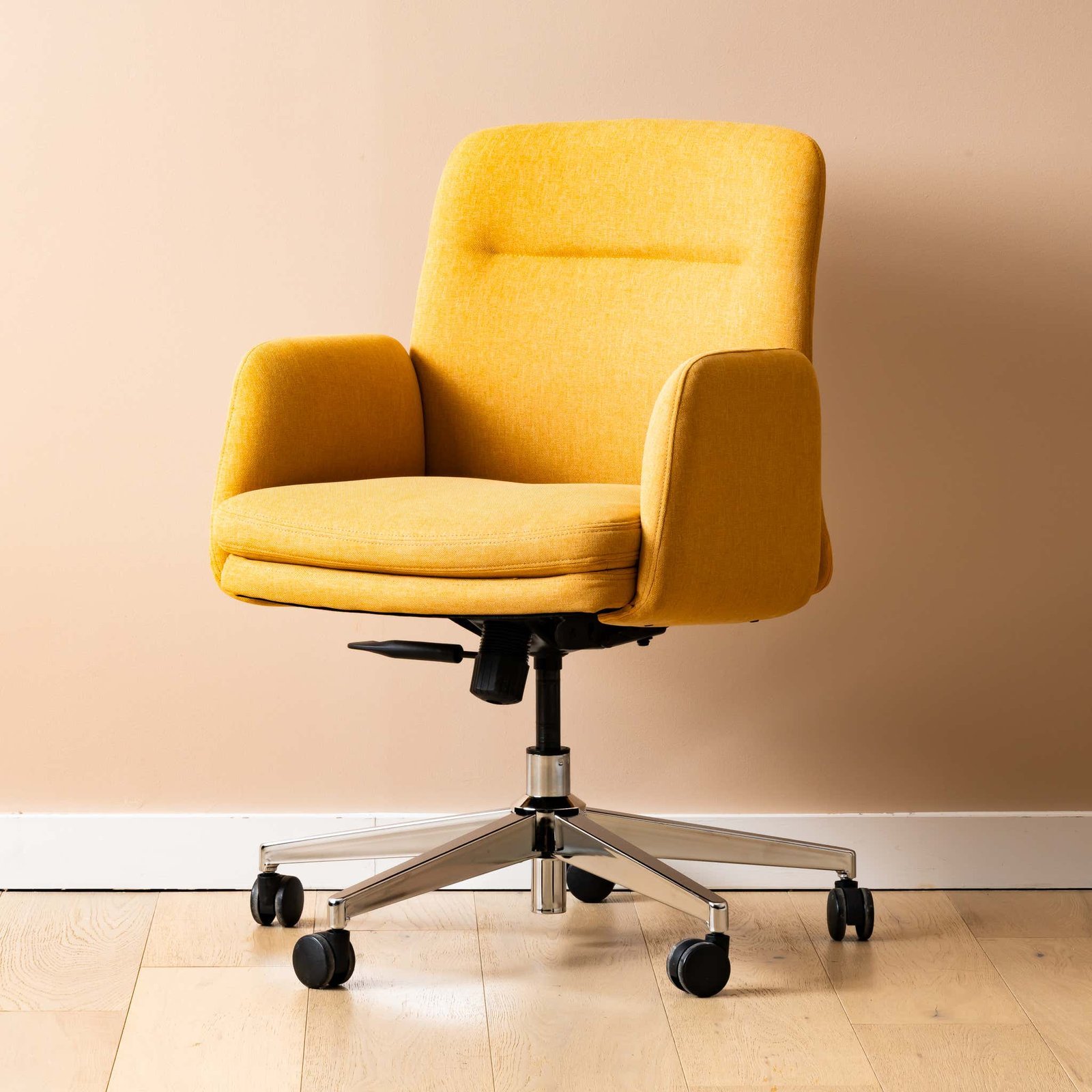 A durable office chair standing in a bright room, showcasing its long-term build quality.