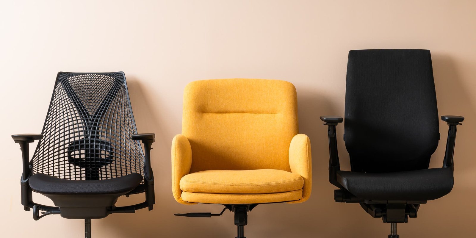 A modern ergonomic office chair displayed in a bright and professional home office setting.