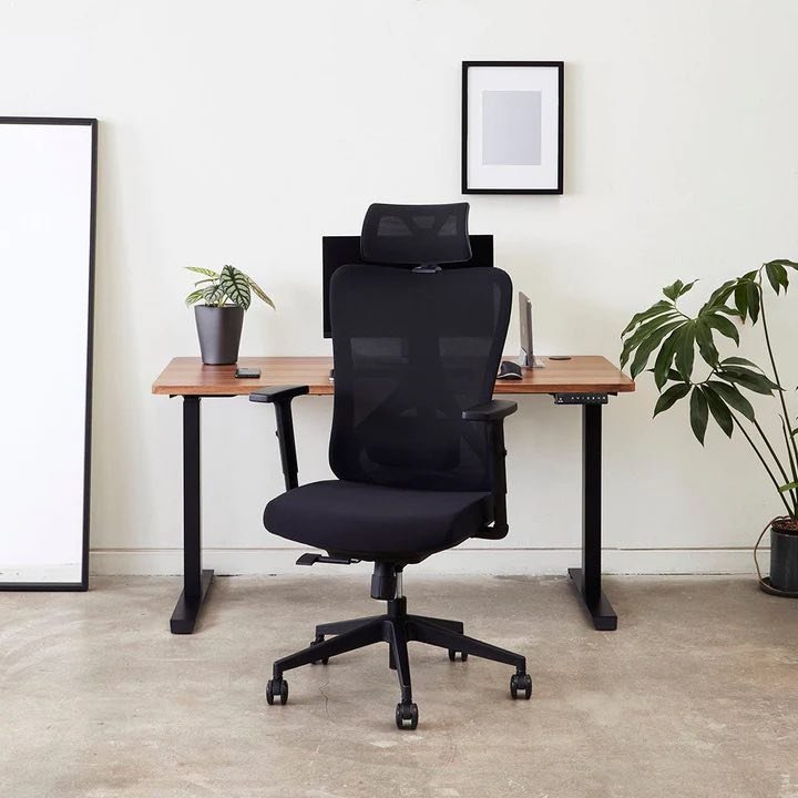 A person sitting with excellent posture in a supportive ergonomic office chair.