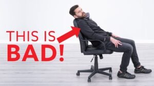 A modern ergonomic chair sits in a bright home office space.
