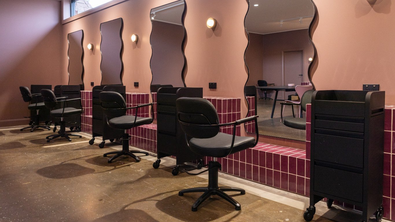 An office chair shown in contexts of both interior design and asset auditing.