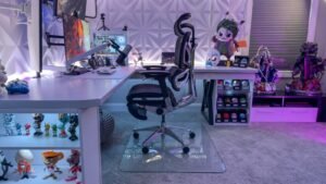 A modern ergonomic office chair sits in a bright, professional workspace.