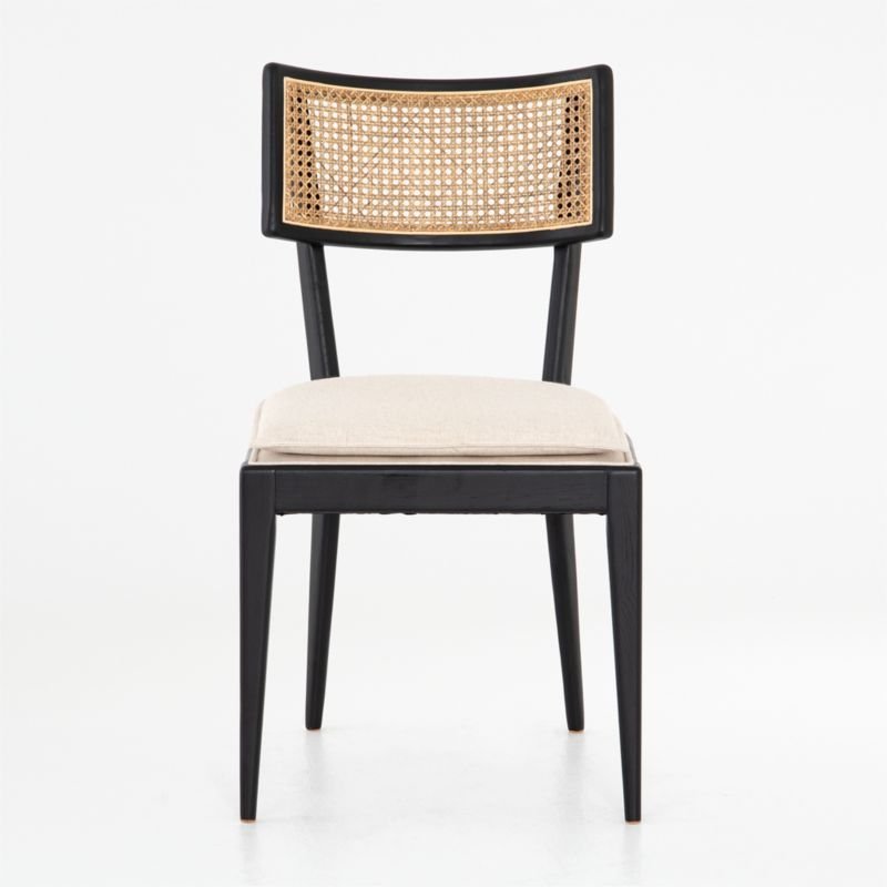 The Libby black wood and natural cane dining chair is shown in a home office setting.