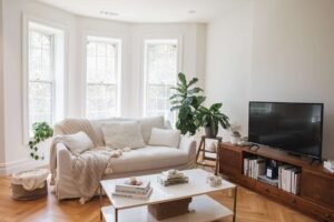A comfortable fabric sofa sits in a bright, modern living room interior.