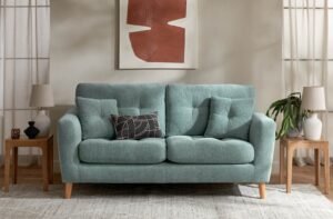 A modern living room with a comfortable sofa creates a peaceful home atmosphere.