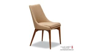 Four elegant upholstered dining room chairs surrounding a wooden table in a sunlit dining area.
