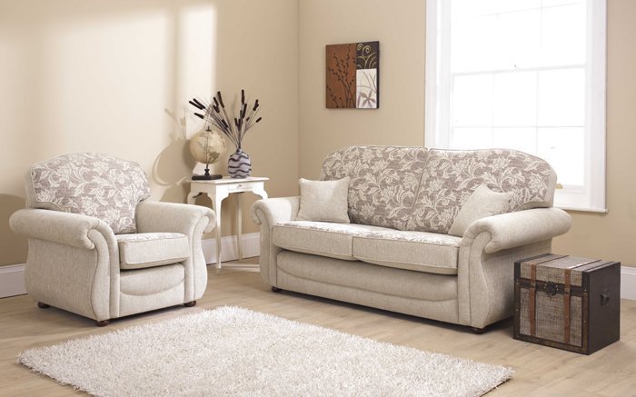 Close-up of a three-piece suite sofa leg showing stable construction and quality upholstery seams.