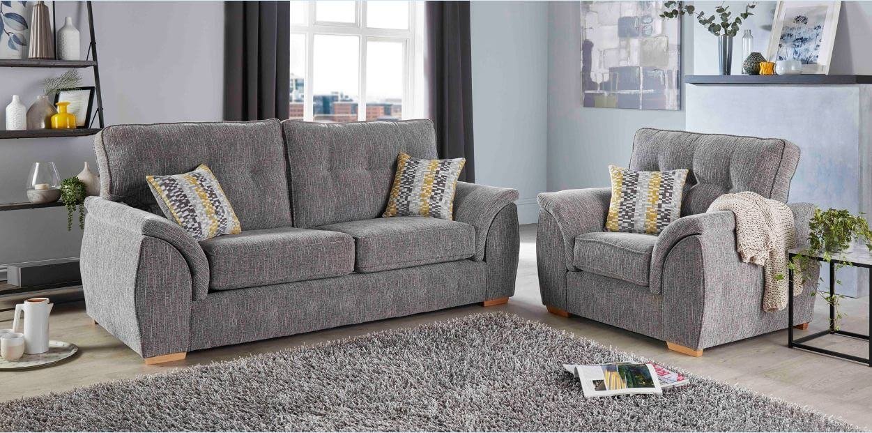 A modern three-piece suite sofa set arranged in a bright, contemporary living room.