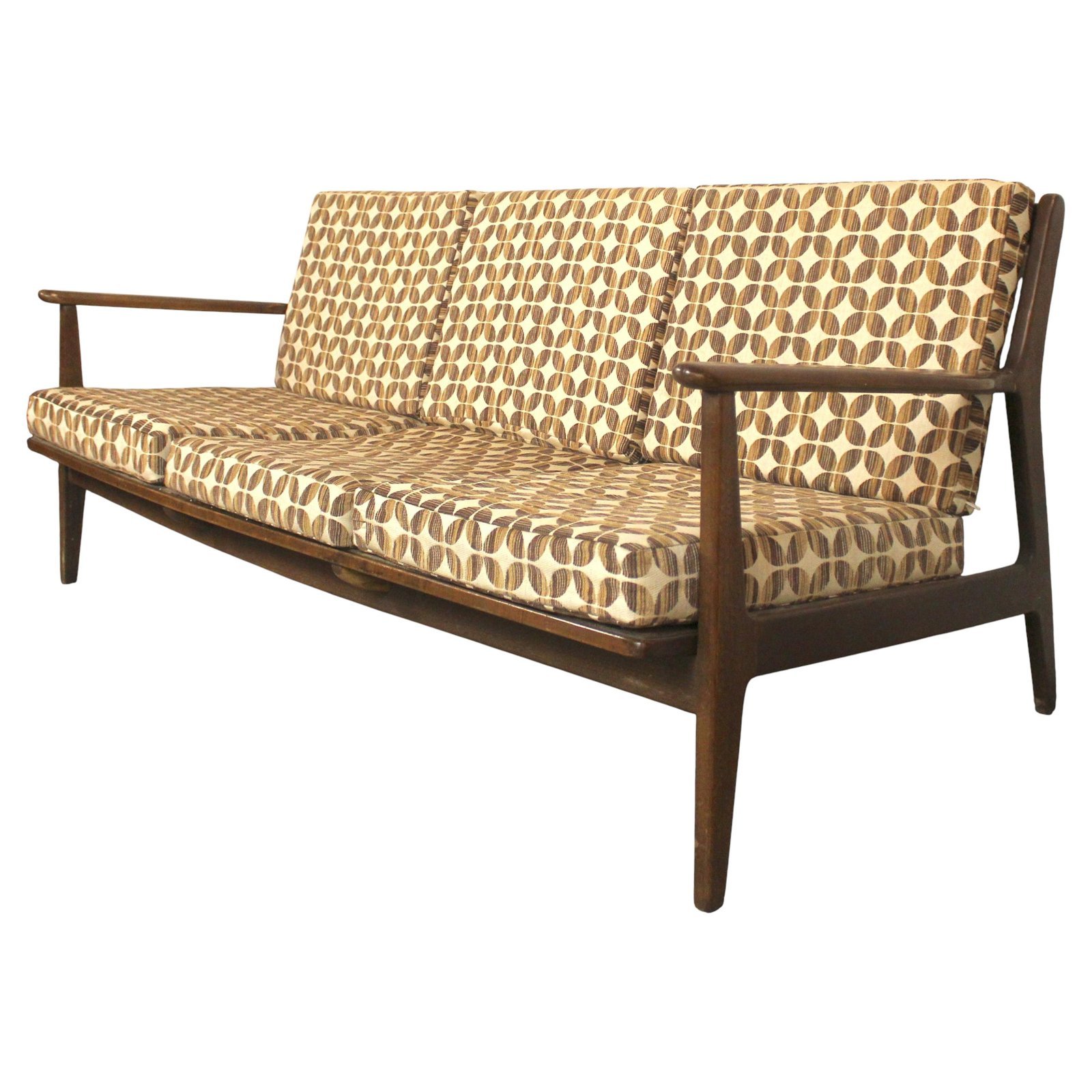 Comparing a bulky rolled-arm sofa with a slim track-arm sofa for space efficiency.