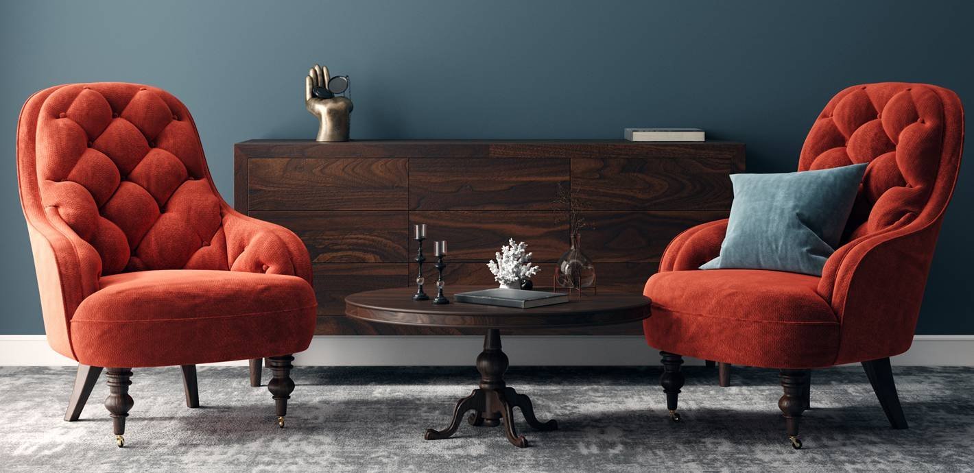 A modern, emerald green accent chair sits elegantly in a bright, minimalist living room.