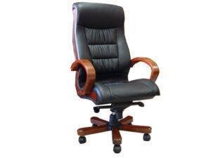 A modern ergonomic office chair with wheels sits in a bright minimalist office space.