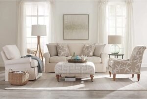 A modern condo sofa sits in a bright apartment living room with soft natural lighting.