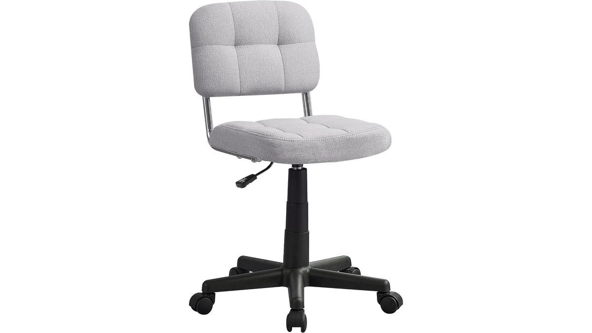 A modern stationary desk chair positioned at a clean wooden home office desk.