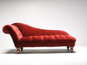 A stylish lounge chair sits in a bright, modern living room space.