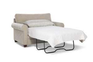A modern twin sleeper chair sits in a bright and airy living room.